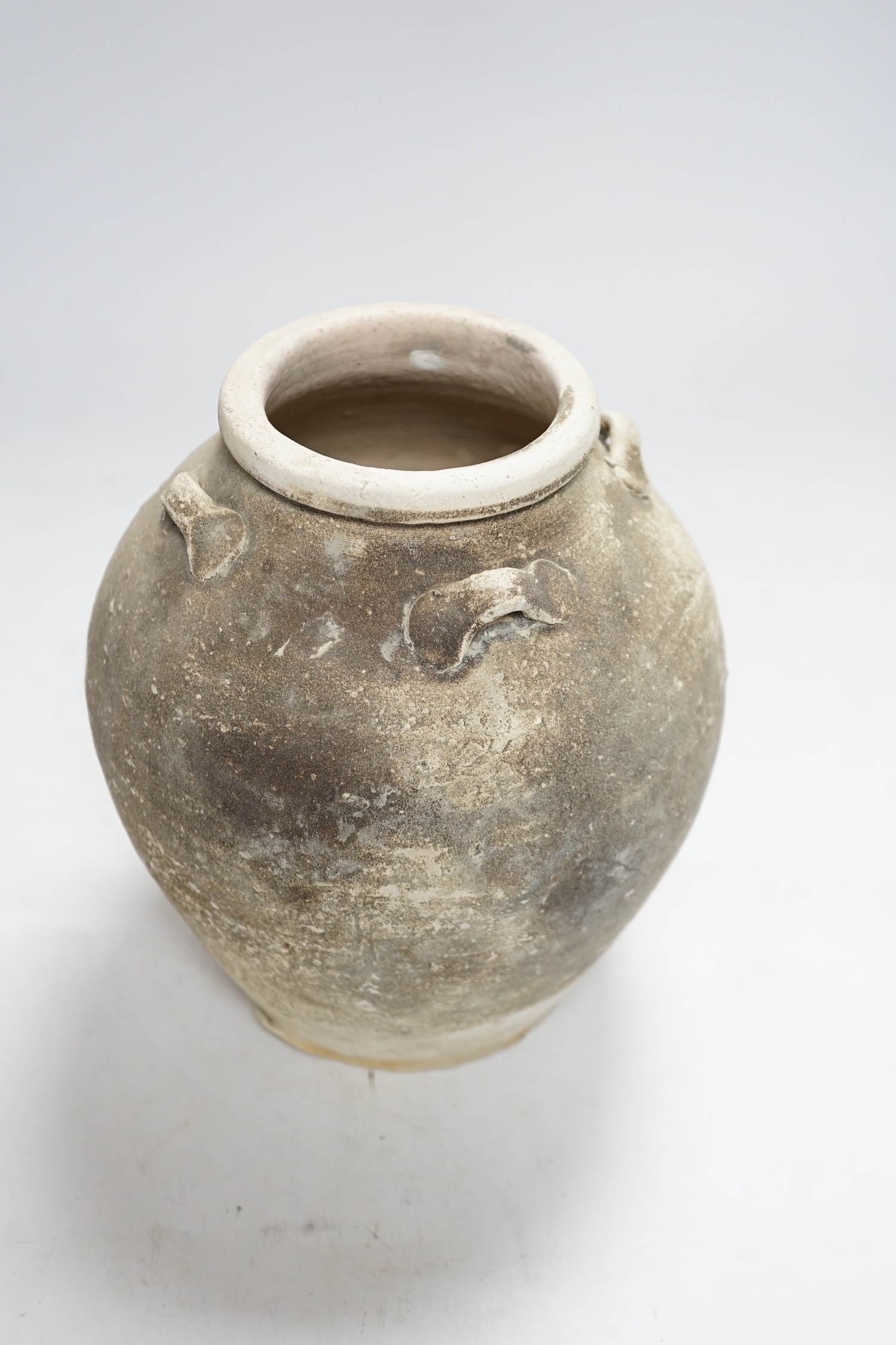 A Chinese pottery jar, Tang Dynasty, 20.5cm high